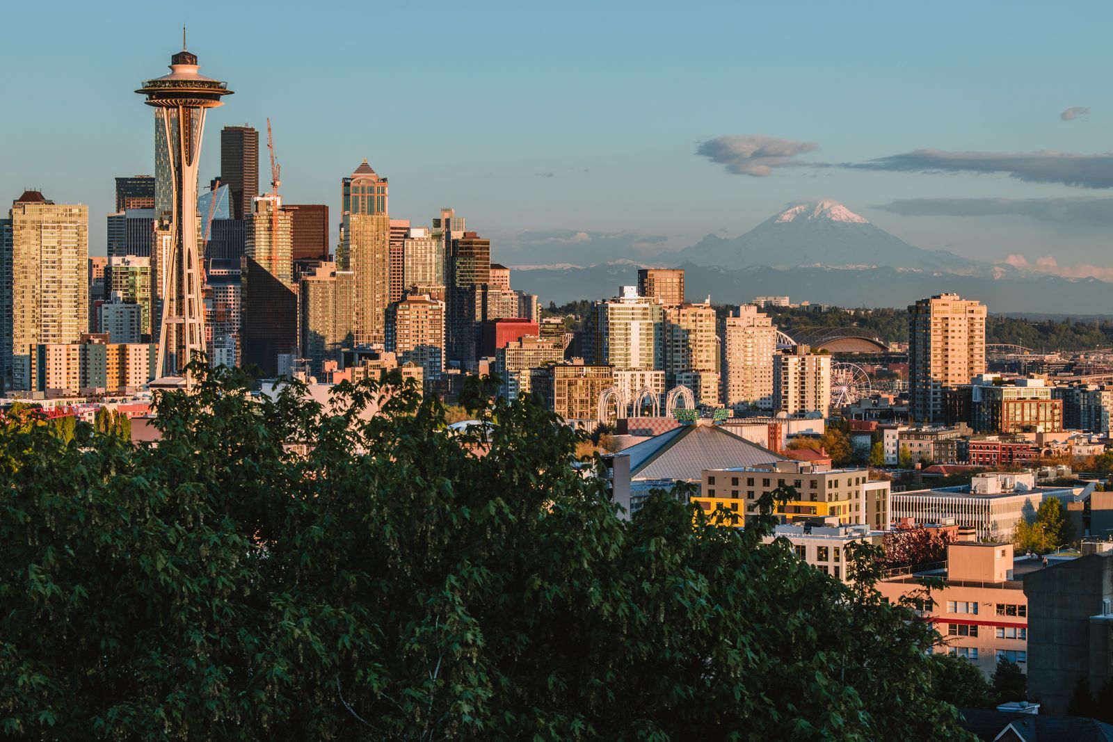 Seattle skyline and the Space Needle in golden evening light, with Mount Rainier in the distance